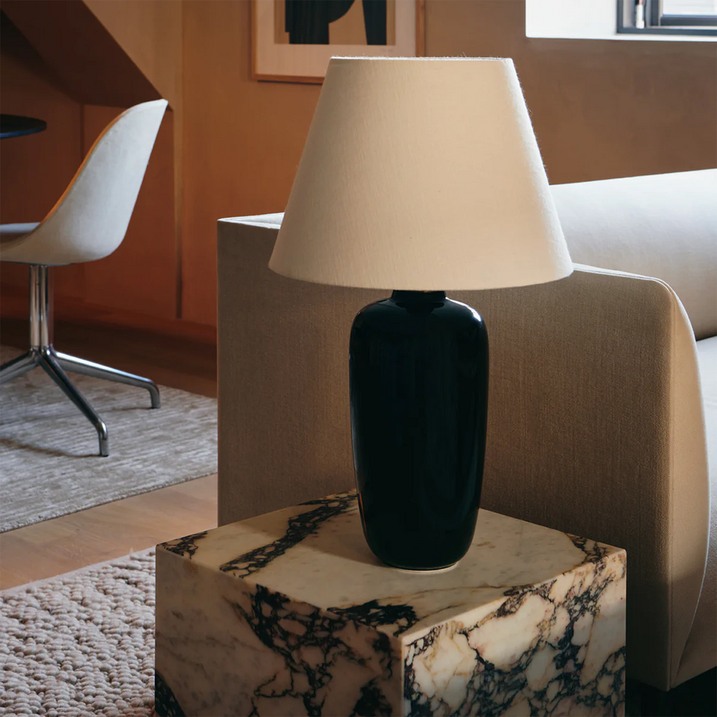 Torso Table Lamp styled on marble Plinth Side Table in guest room at The Audo
