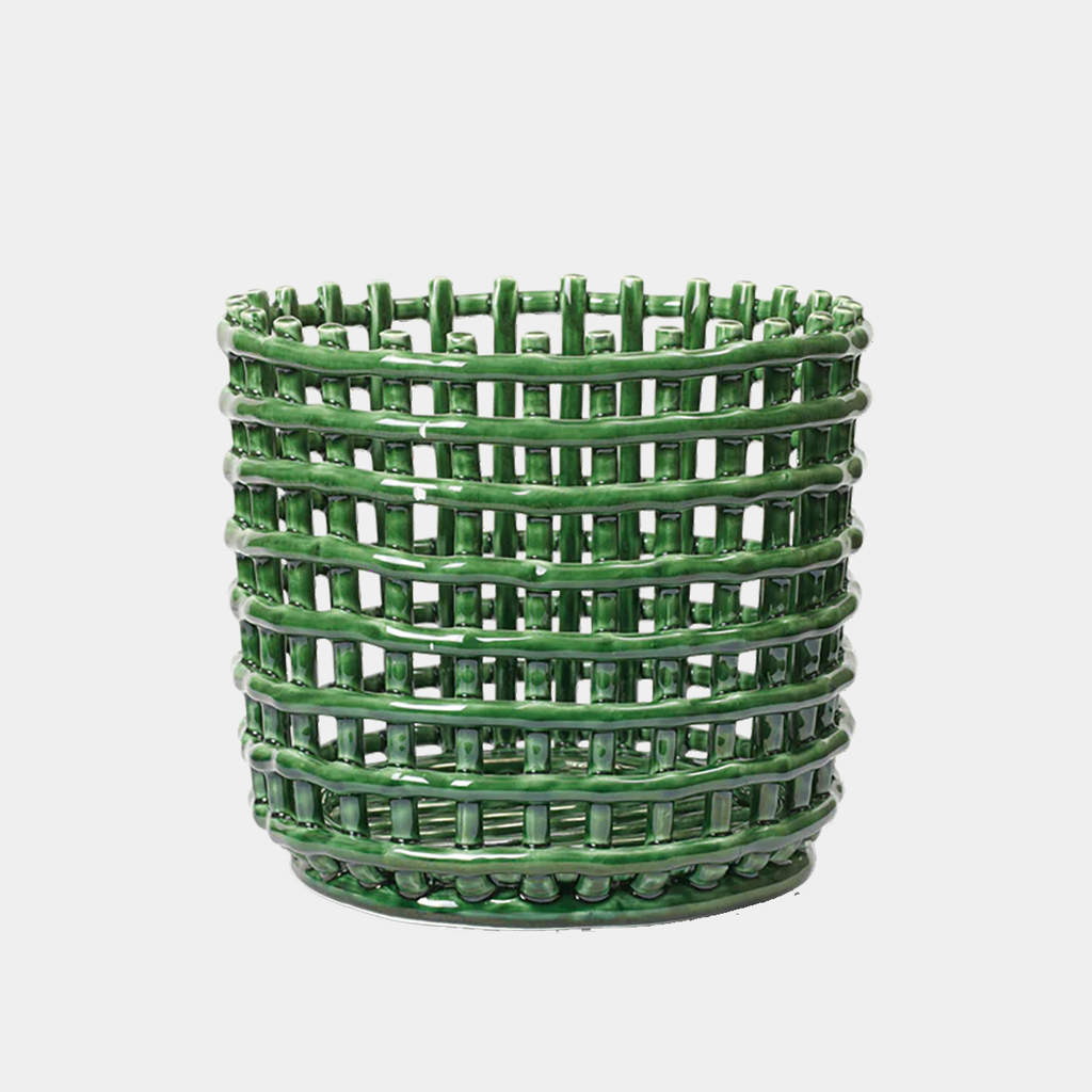 Ferm Living Ceramic Basket Large in Emerald Green — glossy hand-glazed ceramic basket with sculptural woven texture, photographed against a light neutral background