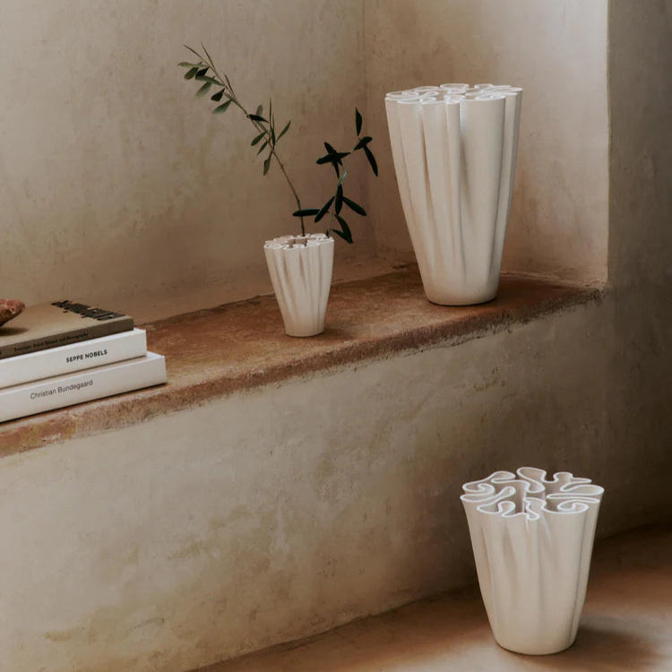 Group of Dedali Vases in small, medium, and large sizes displayed together in minimalist interior