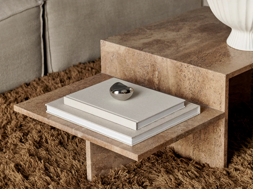 Distinct Coffee Table in Dark Brown Travertine styled in a modern living room with soft, neutral tones.