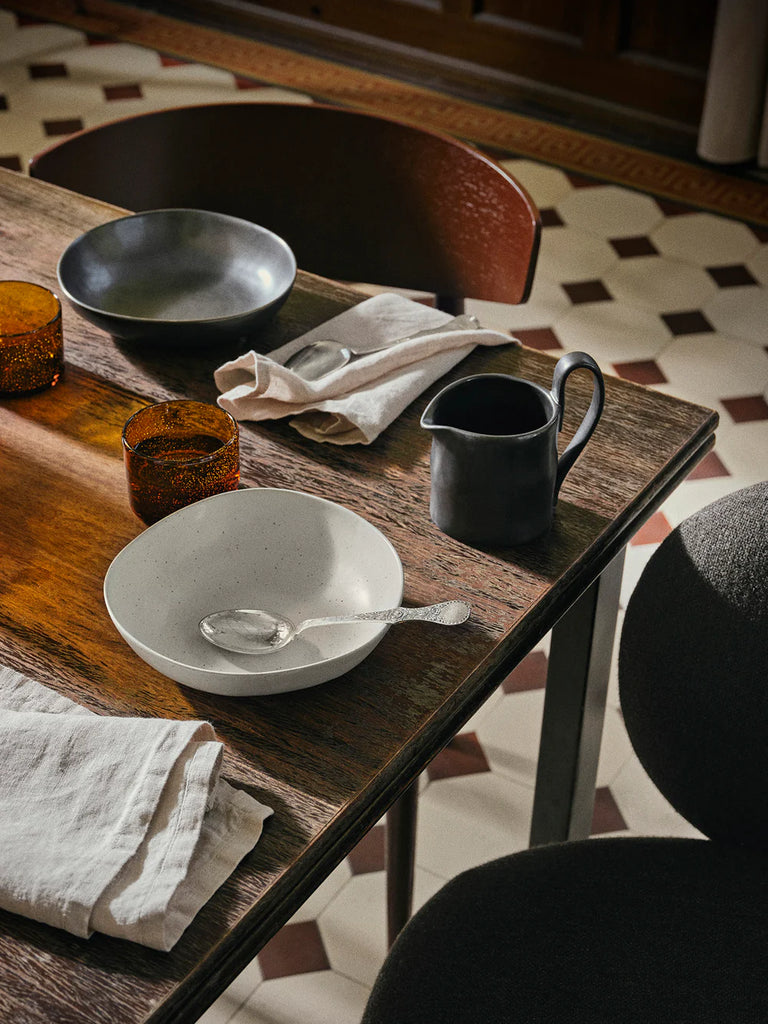 Large Flow Bowl in Off-White styled with contemporary tableware, by Ferm Living.