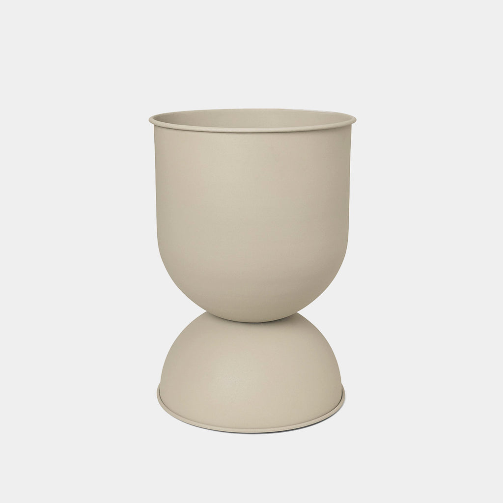 Ferm Living Hourglass Pot in Cashmere, Medium — soft neutral iron planter with inverted hourglass shape.