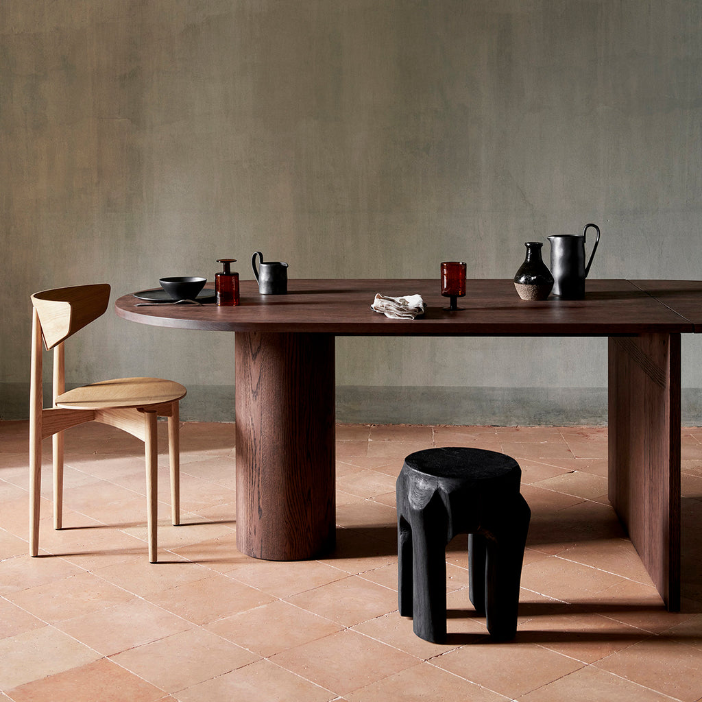 Ferm Living Root Stool shown as a dining stool