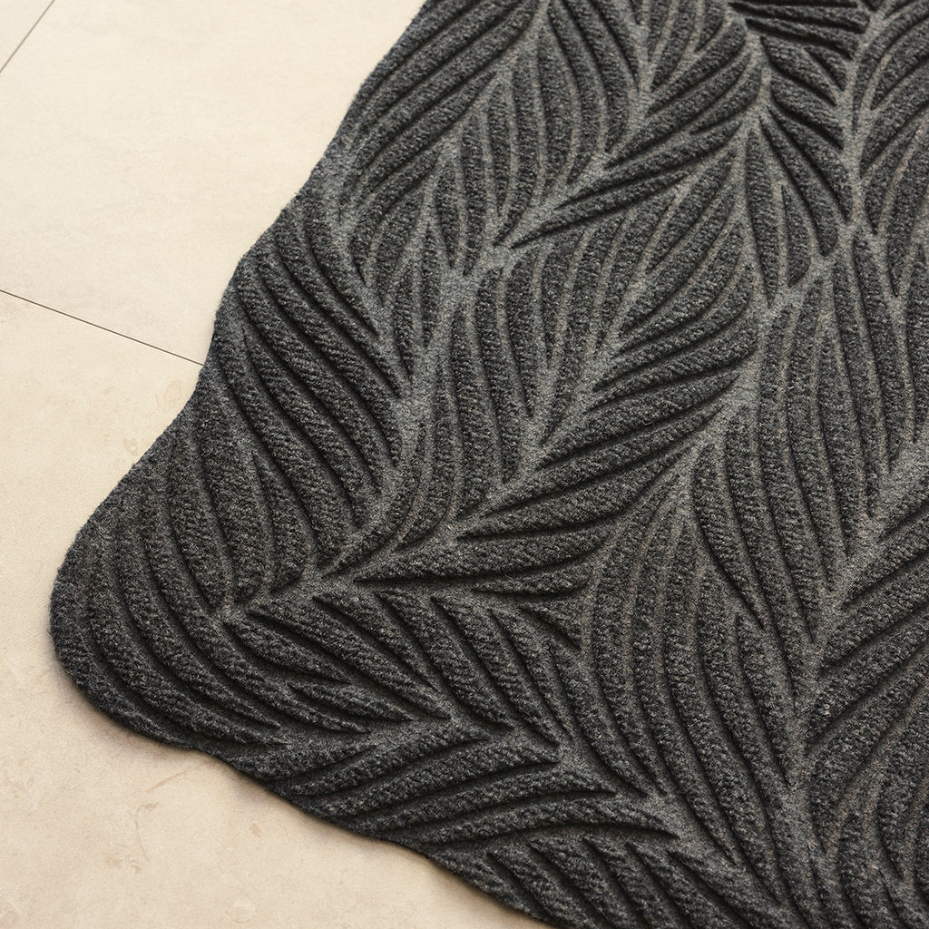 Close up image of Organic-patterned grey Heymat Twine doormat with 3D PET surface for dirt scraping and rubber anti-slip backing
