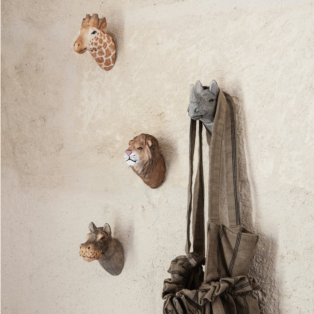 Ferm Living Animal Hand-carved Hooks — Lion, Giraffe, and Elephant grouped on a wall, holding a child’s bag, playful wooden wall hooks for kids’ rooms or entryways