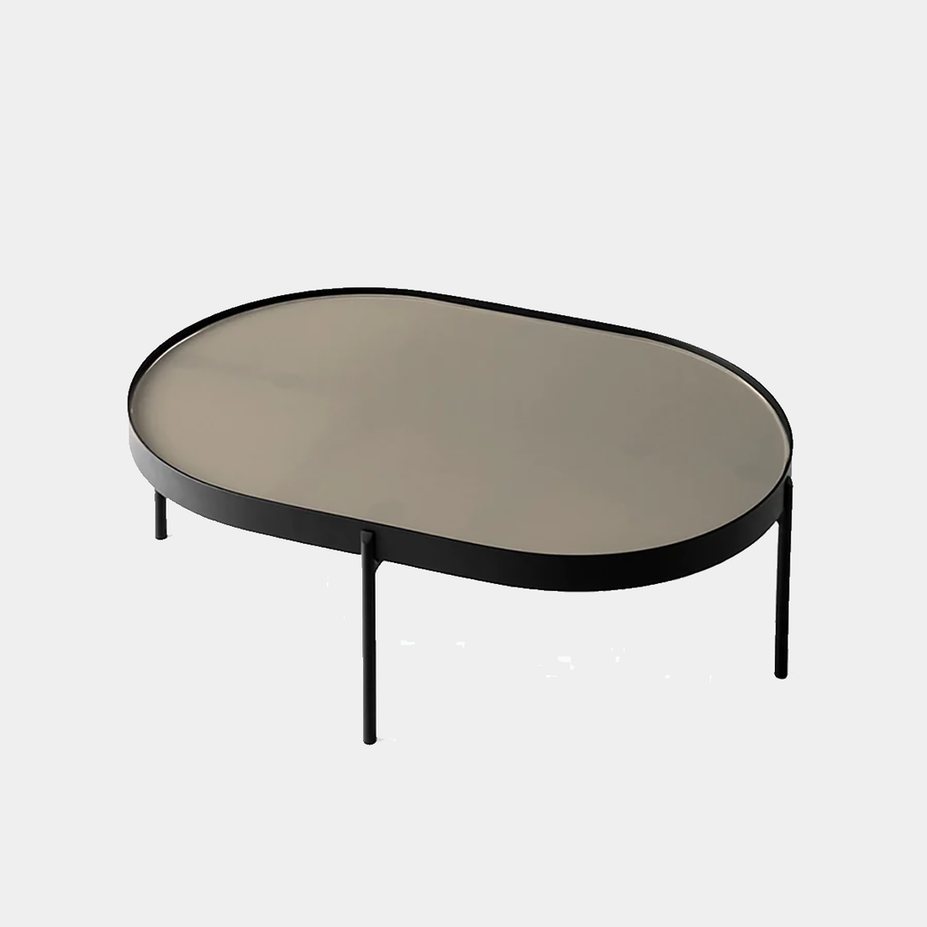 Audo Copenhagen NoNo Table in beige with slender powder-coated metal legs and glass top, shown on a neutral background.