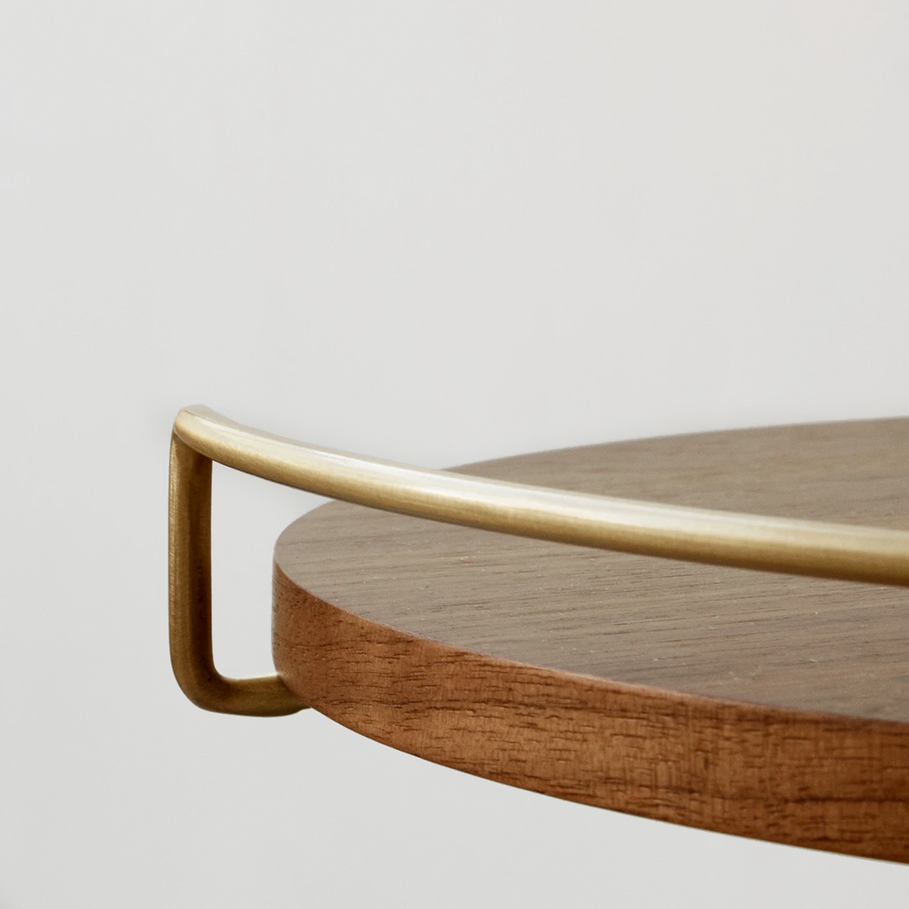Close-up of Umanoff Side Table showing walnut top and brass frame detail