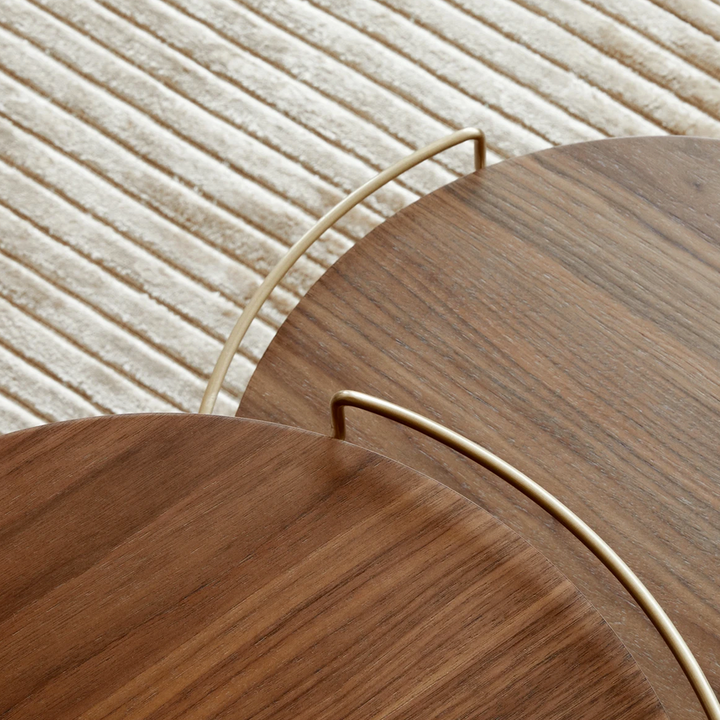 Overhead view of two Umanoff Side Tables with round walnut tops nestled together