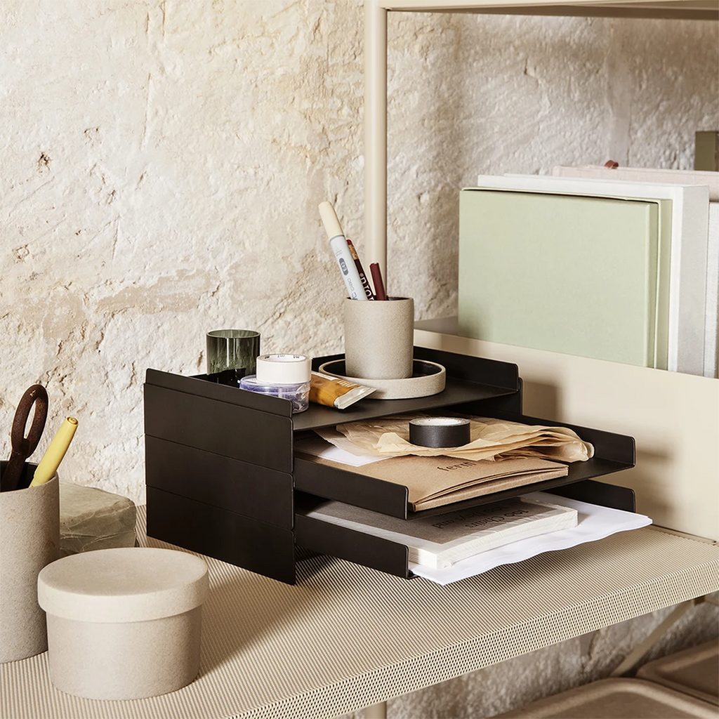 2x2 Organizer in black used for stationery storage on a minimalist desk.