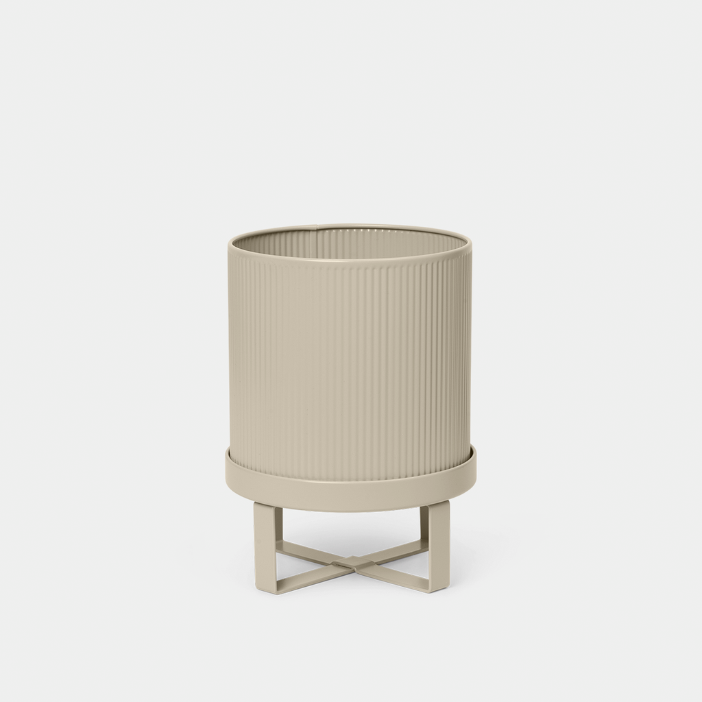 Ferm Living Bau Pot in Cashmere, Small — neutral steel planter with sculptural, modernist design.
