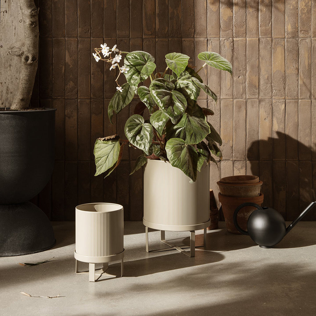 Ferm Living Bau Pot in Cashmere, Large — neutral ribbed metal planter with minimalist elevated base