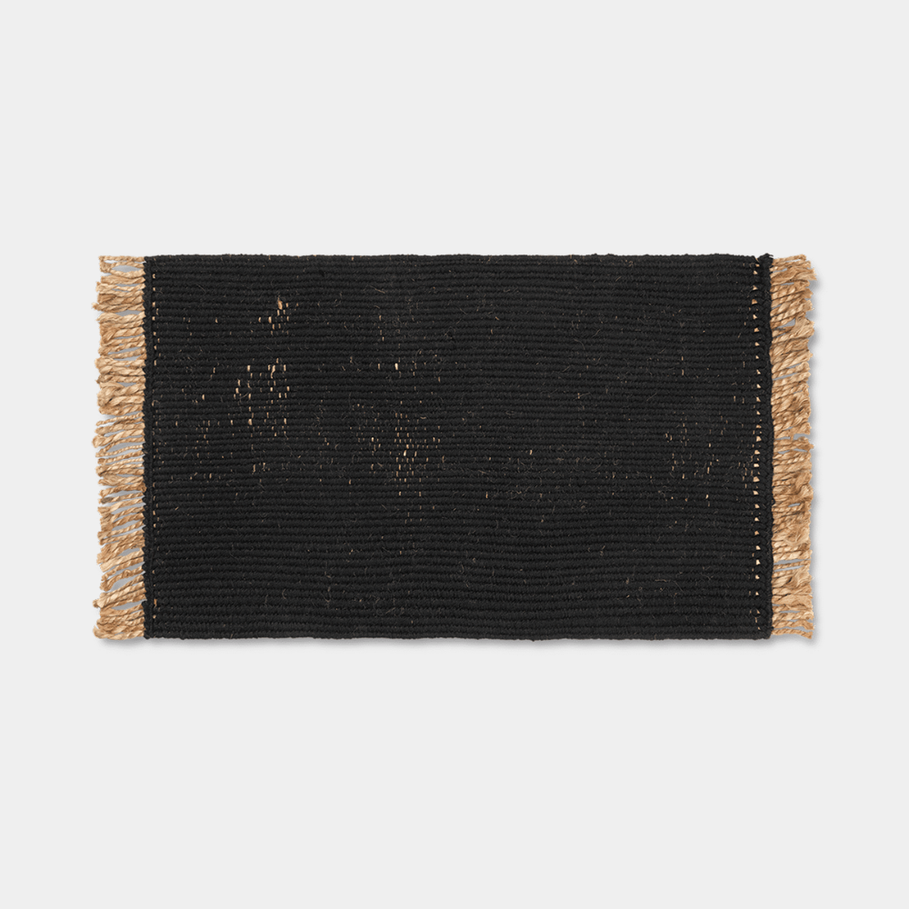 Ferm Living Block Mat in Black with natural fringe, handwoven from jute and cotton.