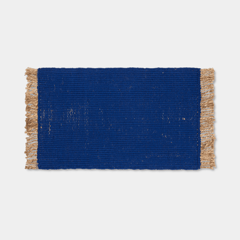 Ferm Living Block Mat in Bright Blue with natural fringe, handwoven from jute and cotton.