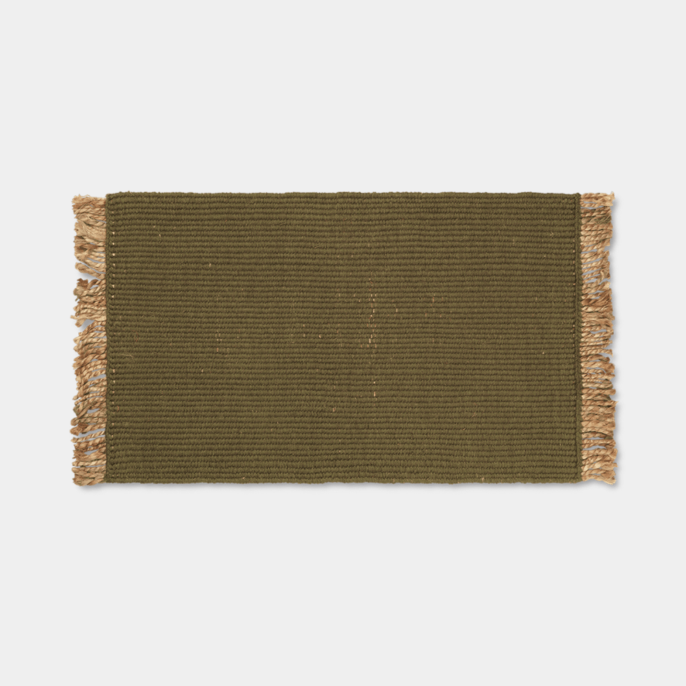 Ferm Living Block Mat in Olive with natural fringe, handwoven texture and soft natural fibers.