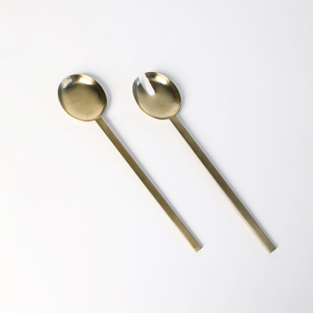 Ferm Living Fein Salad Servers — brushed brass serving spoon and fork set with slim modern profile.