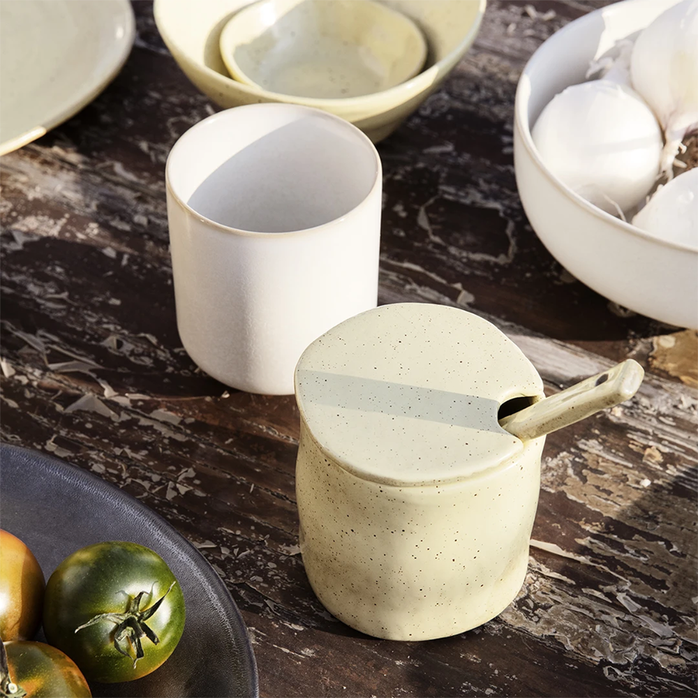 Flow Jam Jar with Spoon in Off-White Speckle styled together on a breakfast table.