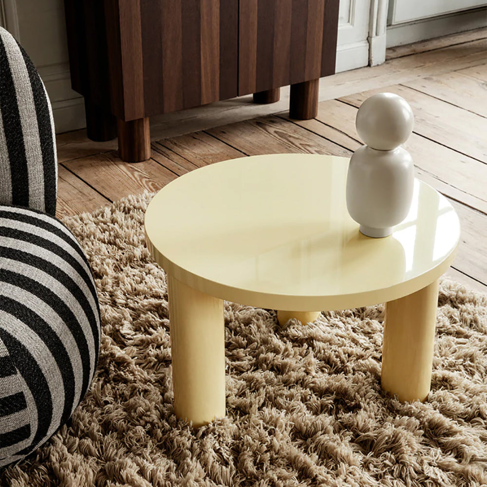 Close-up of Lemonade Post Table Small showing glossy lacquer surface.