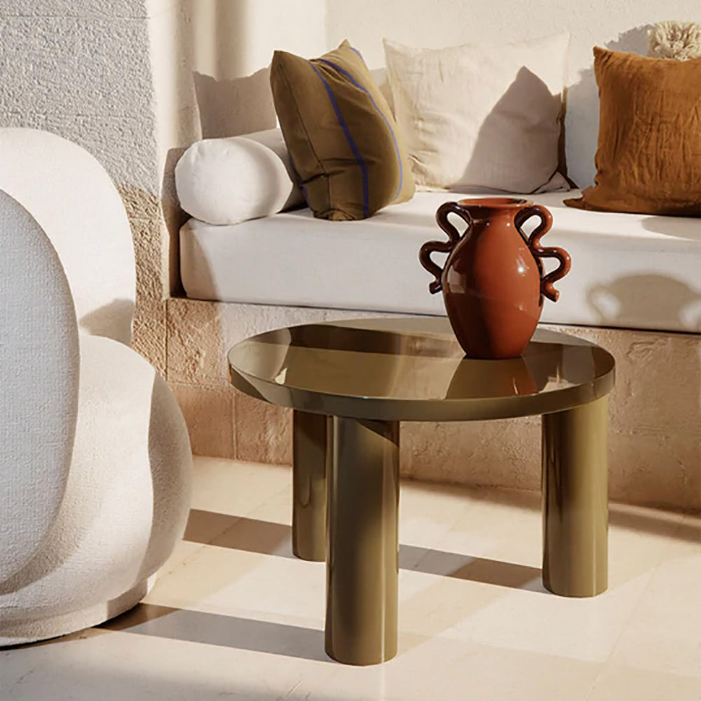 Cashmere Post Table Small in Olive styled next to outdoor sofa holding Verso Vase.