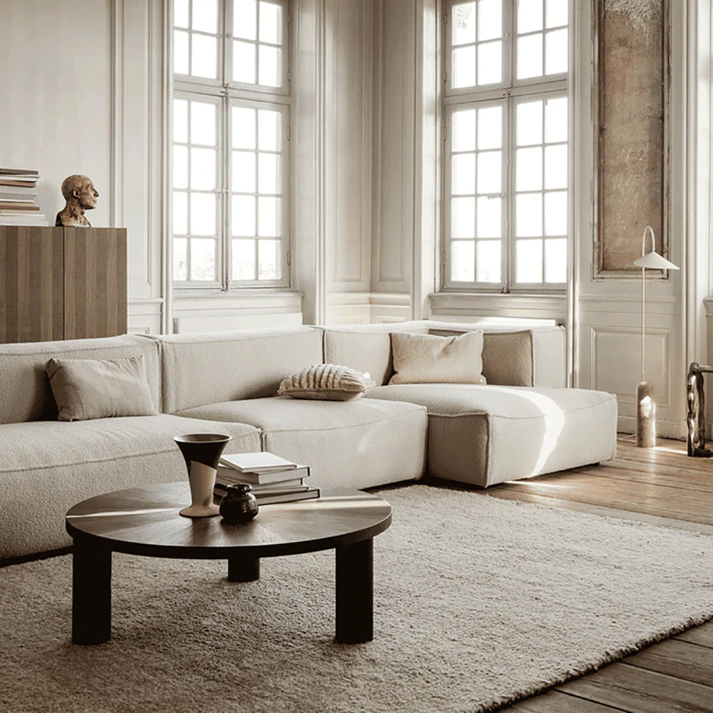 Large Post Coffee Table Star in smoked oak styled in a living room.