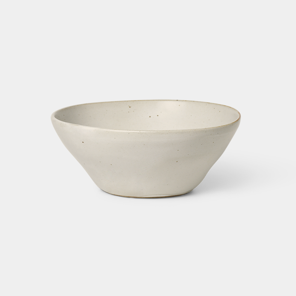 Medium Flow Bowl in Off-White glazed porcelain with semi-matte finish by Ferm Living, available at Nannie Inez.
