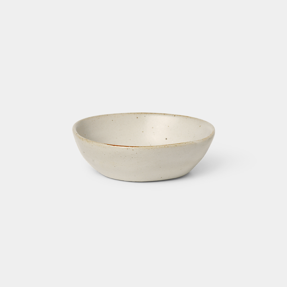 Small Flow Bowl in Off-White glazed porcelain with semi-matte finish by Ferm Living, available at Nannie Inez.
