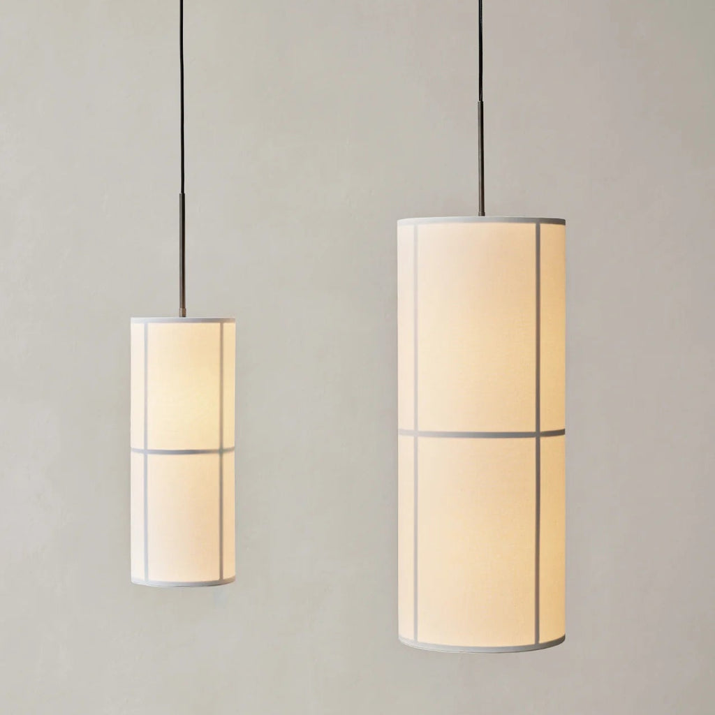 Hashira Pendant lights in raw linen shown in both small and large sizes with warm ambient glow on neutral background