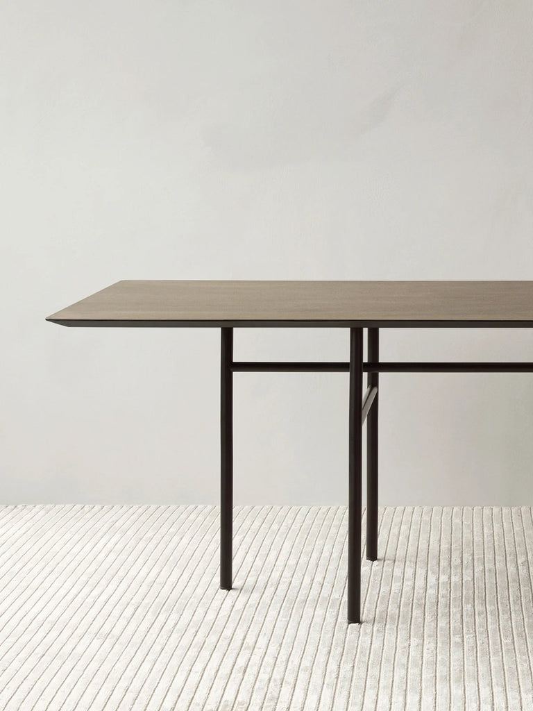 Close up on Audo Copenhagen Snaregade Table in Dark Stained Oak finish.