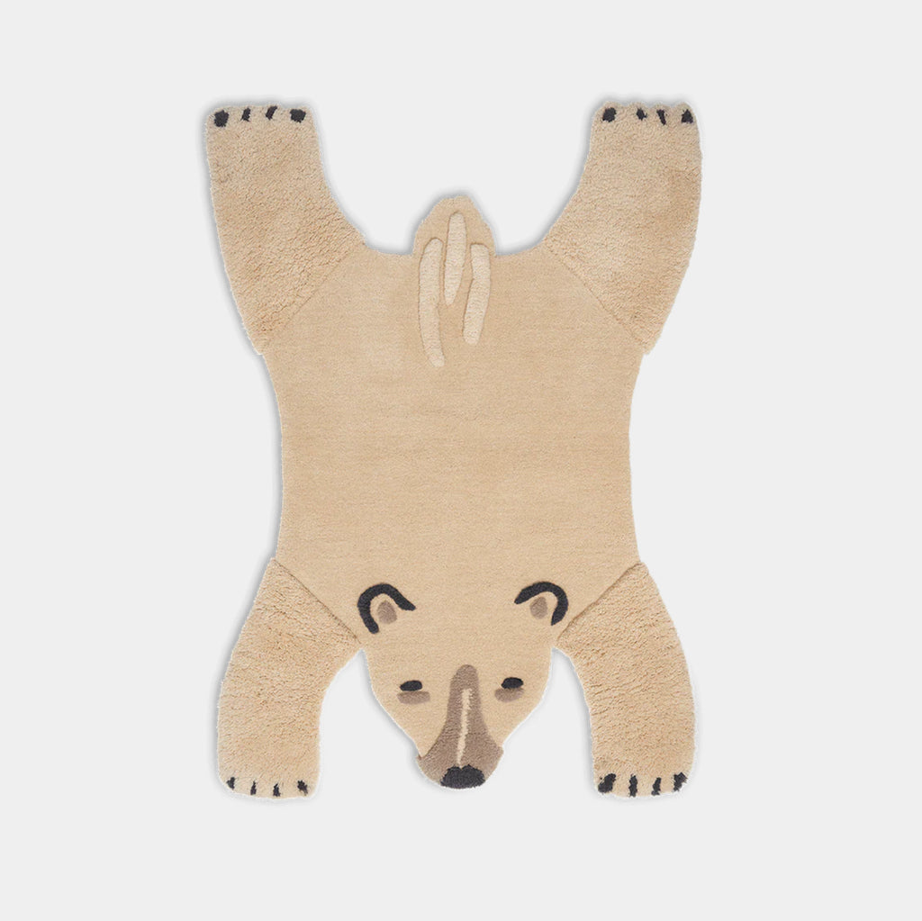 Ferm Living Animal Tufted Floor Rug in off-white on neutral background showing full polar bear shape.