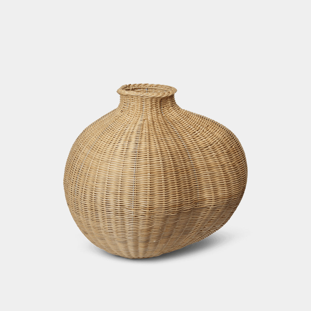 A voluminous, organic statement piece for the home. Hand-braided from natural rattan, the Bola Floor Vase brings artisanal texture and warmth to curated corners.