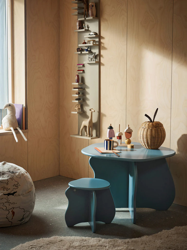Ferm Living Braided Apple Storage in hand-braided rattan styled on a Slope children’s table, highlighting sculptural apple shape and woven texture