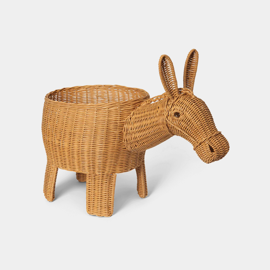 Ferm Living braided donkey storage in natural rattan with sculptural form on neutral background