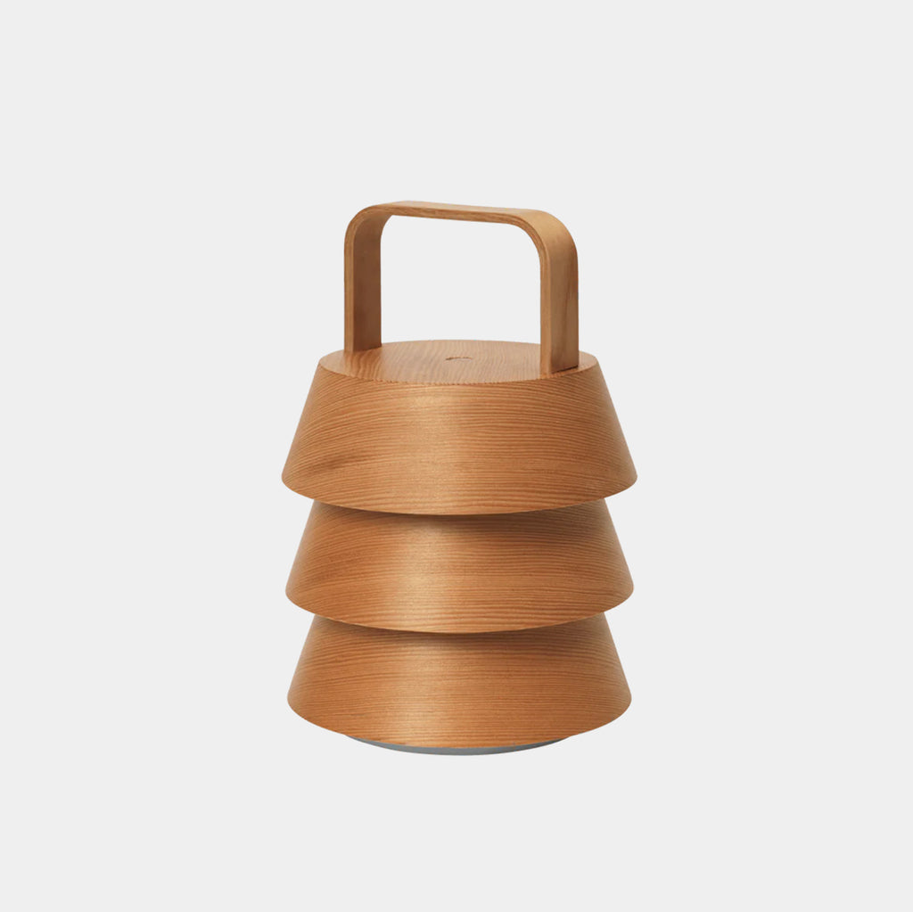 Ferm Living Luver portable lamp in natural Douglas fir on neutral background