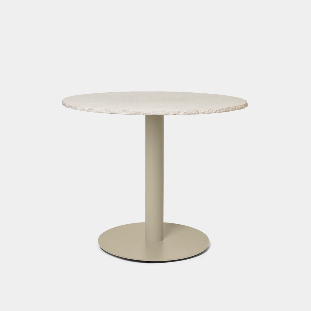 Ferm Living Mineral Dining Table in Bianco Curia marble featuring hand-chiseled edge detail and round stone tabletop with cashmere base