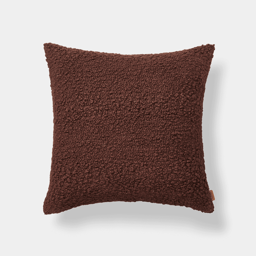 Ferm Living Moor cushion in Dark Pecan wool and cotton bouclé on neutral background