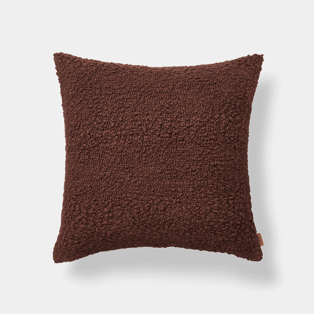 Ferm Living Moor cushion in Dark Pecan wool and cotton bouclé on neutral background