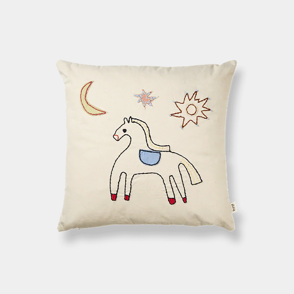 Ferm Living Naïve Cushion with embroidered horse illustration in organic cotton on a neutral background.
