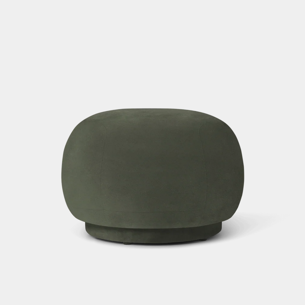 Rico Pouf with curved silhouette upholstered in rich velvet Pine on neutral background