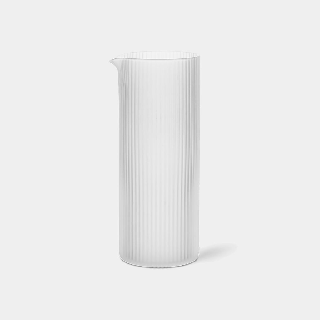Ripple Milk Jug by Ferm Living in mouth-blown ribbed clear frosted glass with sculptural silhouette and precision pouring spout