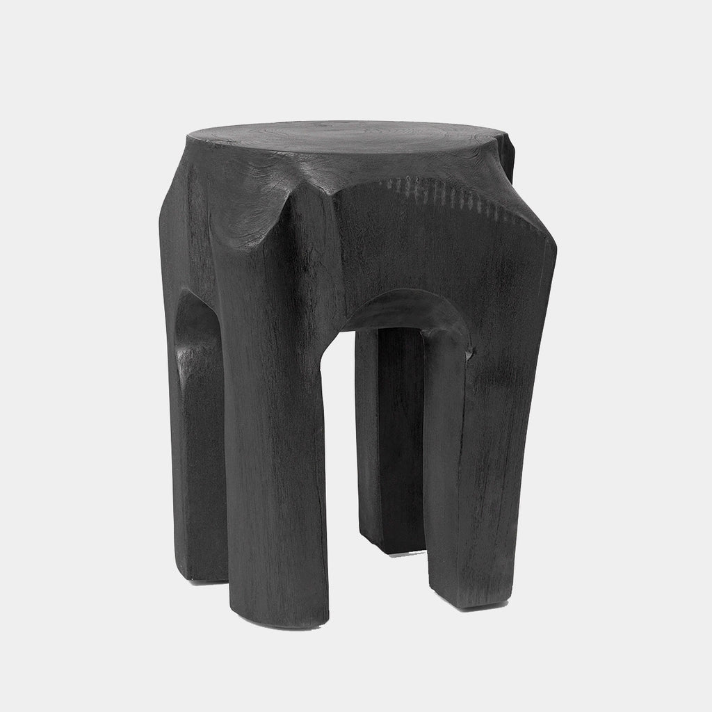 Ferm Living Root Stool in black-stained teak, hand-carved from a single teak tree root