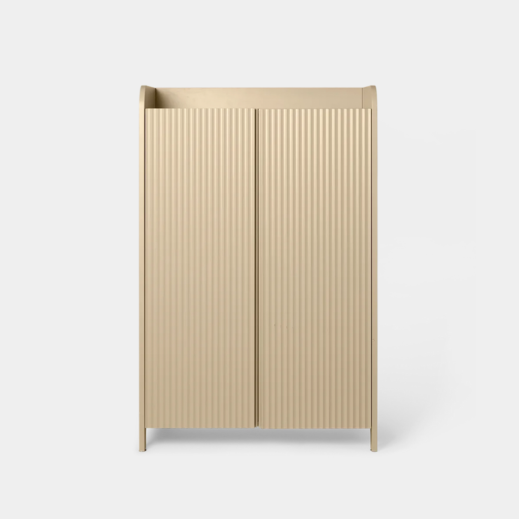 Front view of the dark oak Ferm Living Sill Cupboard in cashmere with vertical fluted doors and black knobs