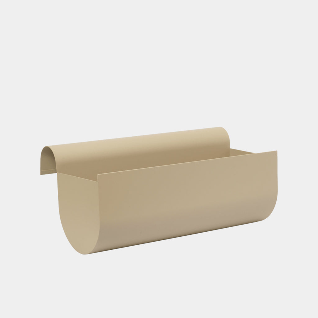 Medium ferm LIVING Uma Balcony Box in Cashmere powder-coated steel, showing its sculptural minimalist silhouette.