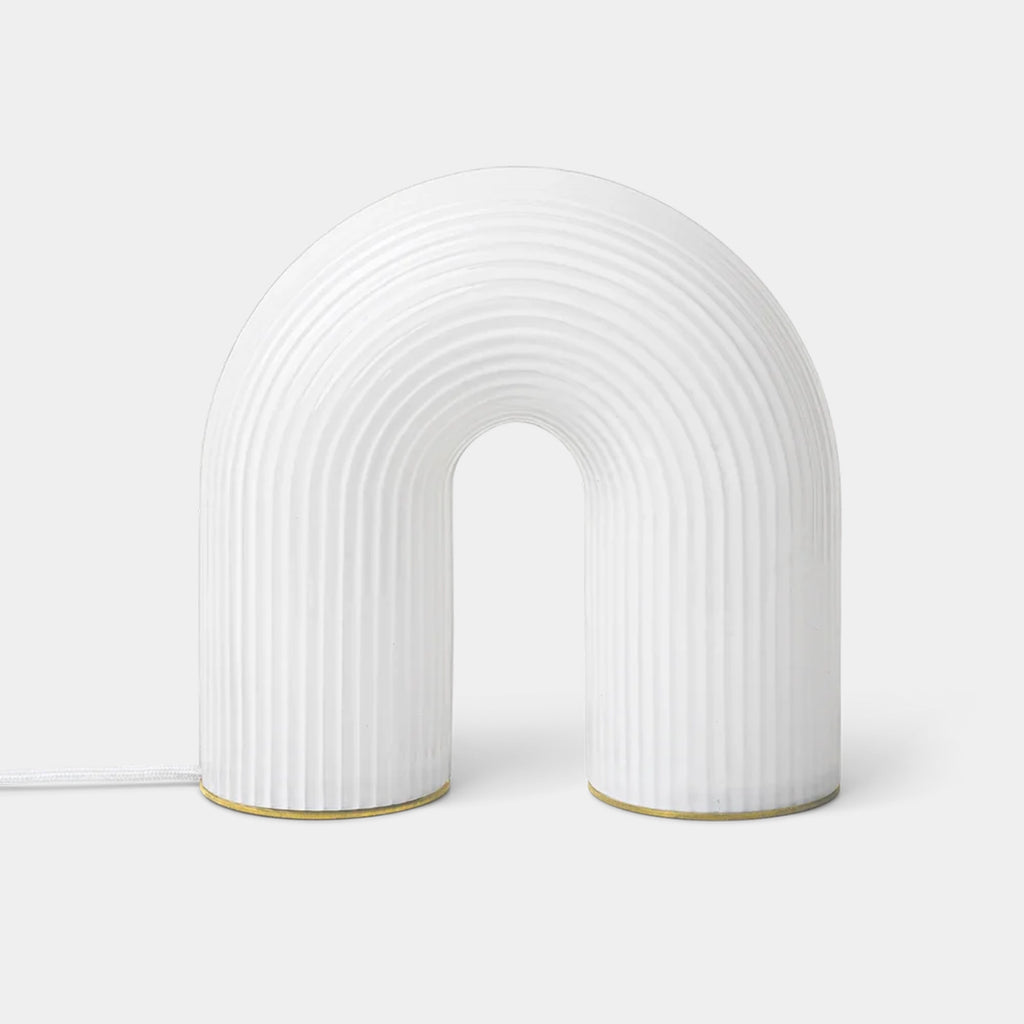 Ferm Living Vuelta Table Lamp in White with arched form and rippled opal glass
