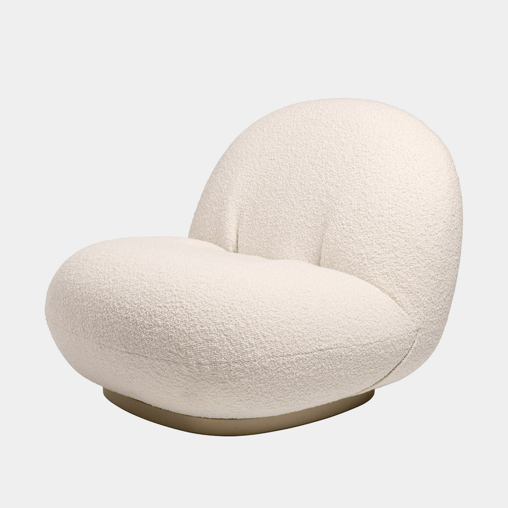 GUBI Pacha Chair upholstered in Karakorum fabric with soft textured surface and sculptural rounded form