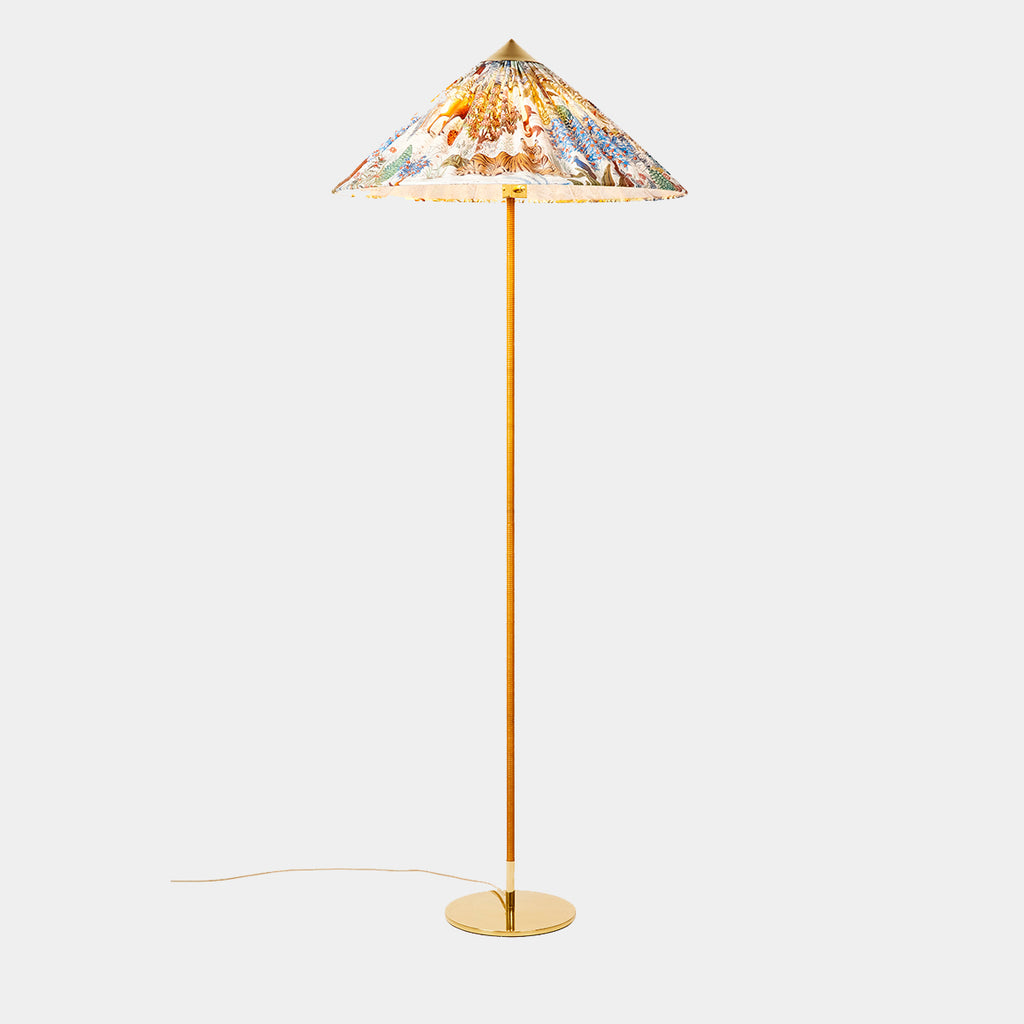 GUBI × Pierre Frey 9602 Floor Lamp with polished brass base and pleated Le Jardin du Palais shade.