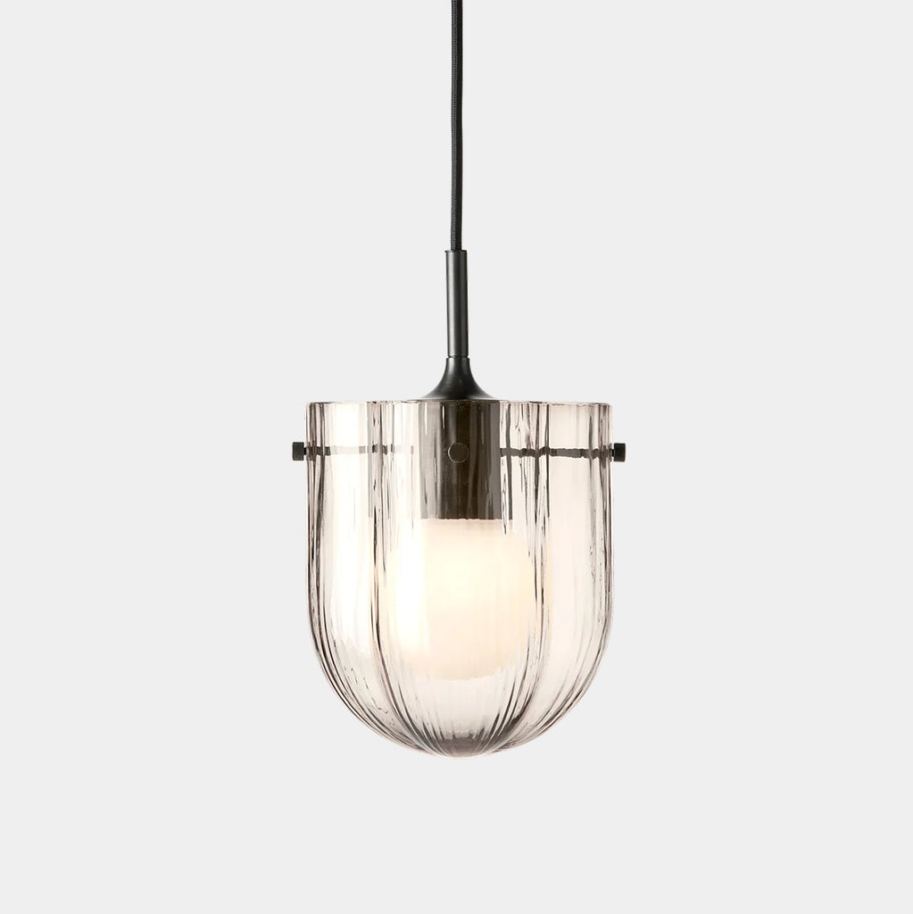 GUBI Seine Pendant in Smoke glass and antique brass showing translucent glass texture.