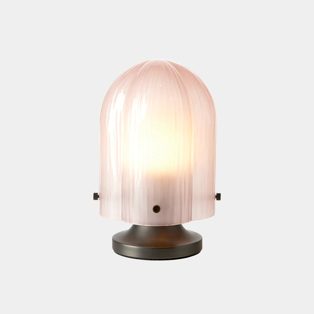 GUBI Seine Table Lamp in Coral glass with antique brass base casting warm diffused light