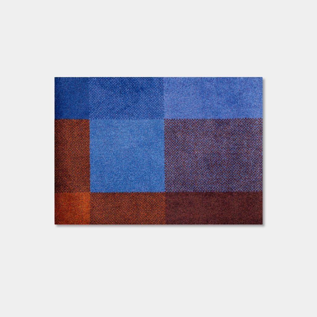 Heymat Mix Dusk indoor doormat in blue, burgundy and brown color blocks, small size