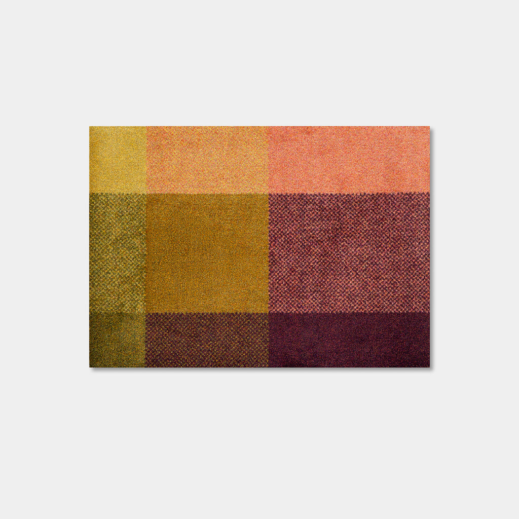 Heymat Mix Zest indoor doormat in green, ochre, pink and burgundy color blocks, small size