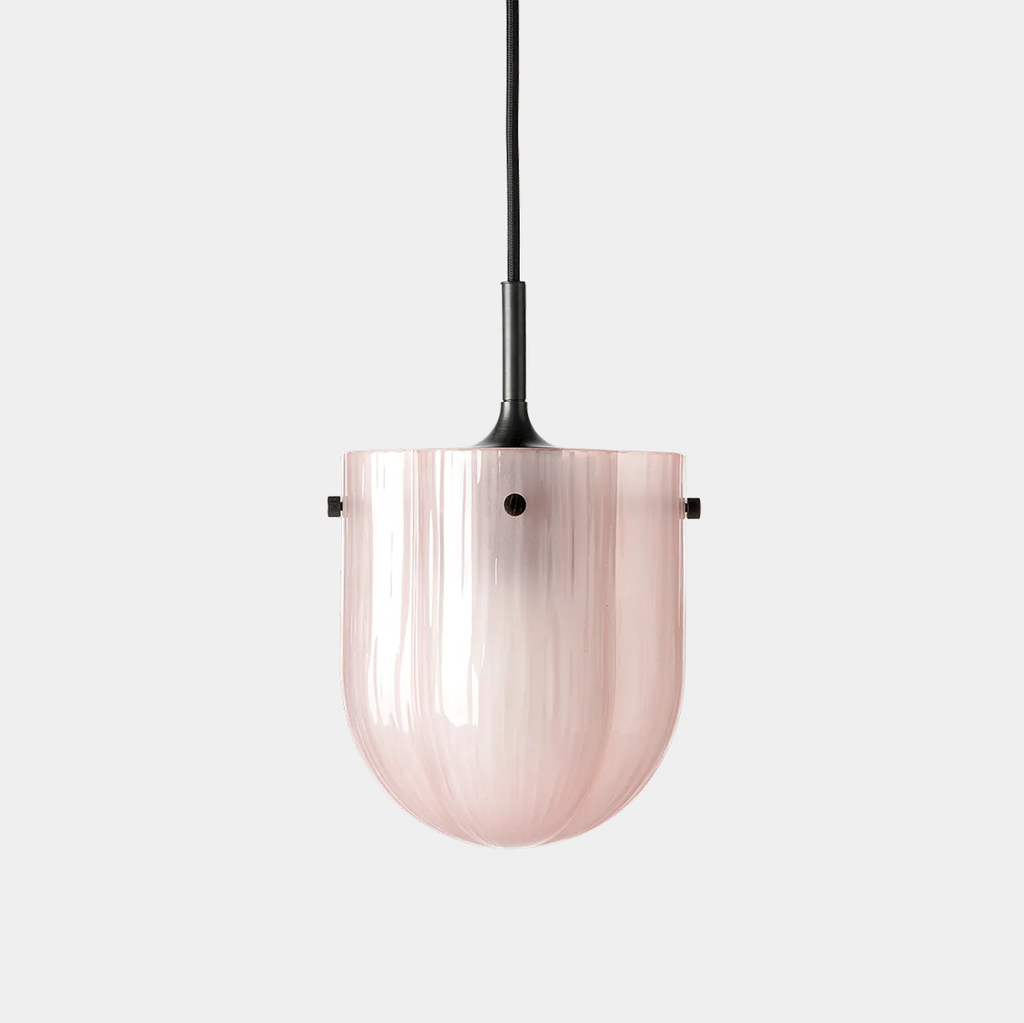 GUBI Seine Pendant in Coral glass and antique brass with soft, diffused glow.