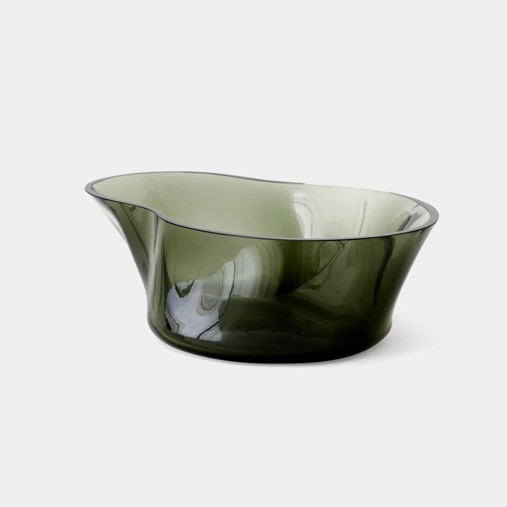 Audo Copenhagen Aer Bowl in smoked hand-blown glass with fluid, asymmetrical form, shown on a neutral background.